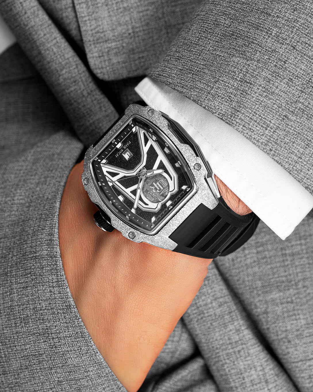 Paul Rich Astro Meteora with frosted silver bezel and meteorite inlay, worn with a grey suit and white cuff, hand tucked into pocket. Paul Rich Astro Meteora with frosted silver bezel and meteorite inlay, worn with a grey suit and white cuff, hand tucked into pocket.