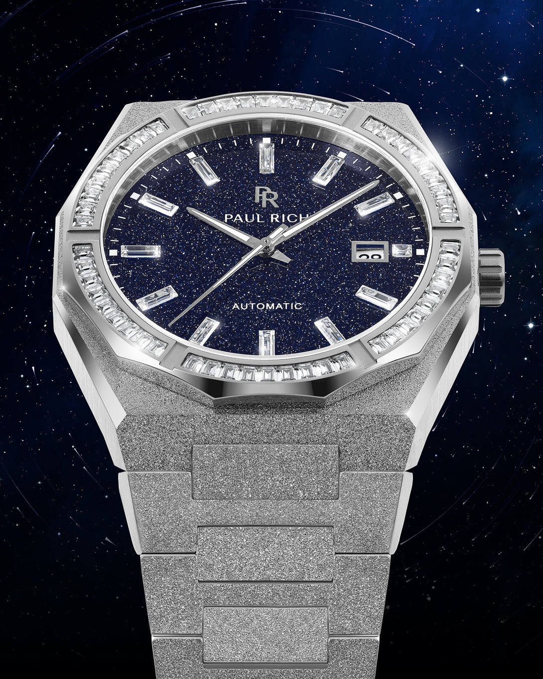 Silver frosted watch with blue aventurine dial, moissanite bezel, and date window at 3 o’clock displayed against a starry night background. Silver frosted watch with blue aventurine dial, moissanite bezel, and date window at 3 o’clock displayed against a starry night background.