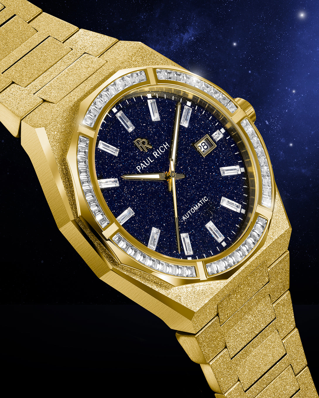 Gold frosted watch with blue aventurine dial and moissanite bezel displayed at an angle against a starry night sky background. Gold frosted watch with blue aventurine dial and moissanite bezel displayed at an angle against a starry night sky background.