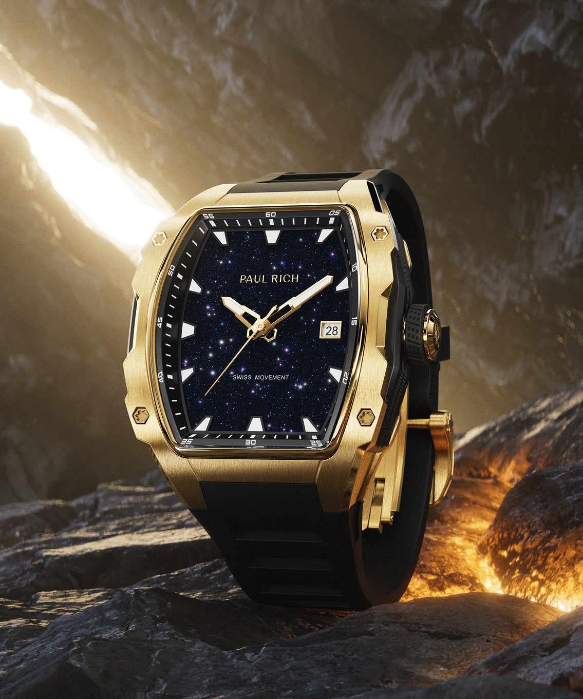 Paul Rich gold-tonneau watch with blue aventurine dial, gold-tone hands, and black strap displayed on dark rocks with glowing lava. Paul Rich gold-tonneau watch with blue aventurine dial, gold-tone hands, and black strap displayed on dark rocks with glowing lava.