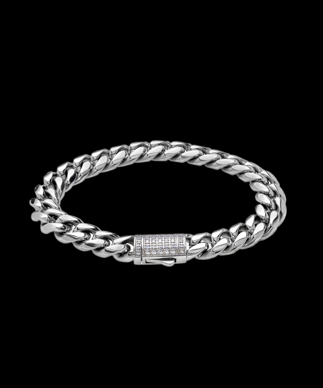 Silver Cuban link bracelet with a box clasp encrusted in small white stones, shown on a transparent background. Silver Cuban link bracelet with a box clasp encrusted in small white stones, shown on a transparent background.