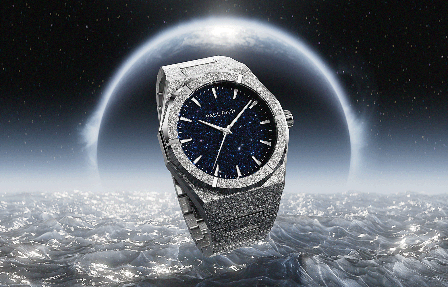 Paul Rich frosted silver watch with blue aventurine dial floating above icy waves with a glowing planet and starry space in the background. Paul Rich frosted silver watch with blue aventurine dial floating above icy waves with a glowing planet and starry space in the background.