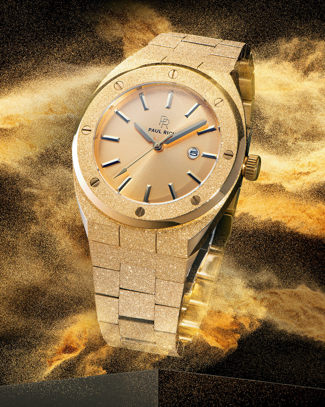 Paul Rich watch with frosted gold case and bracelet, metallic champagne gold sunray dial, and date window, shown in golden sandburst explosion on black. Paul Rich watch with frosted gold case and bracelet, metallic champagne gold sunray dial, and date window, shown in golden sandburst explosion on black.