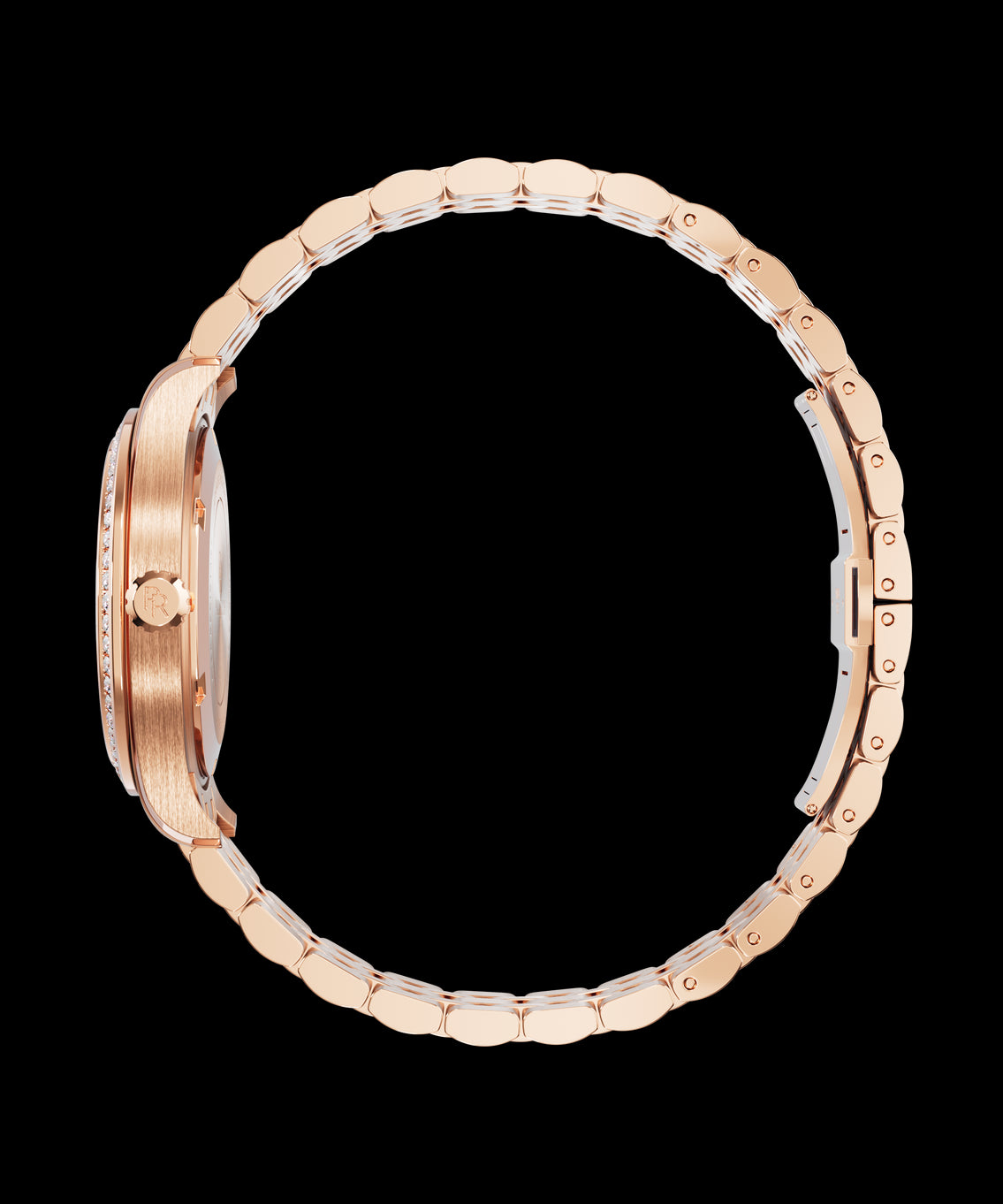 Side view of a rose gold wristwatch with a gem-set bezel, “PR” logo on the crown, and a fully closed rounded link bracelet. Side view of a rose gold wristwatch with a gem-set bezel, “PR” logo on the crown, and a fully closed rounded link bracelet.