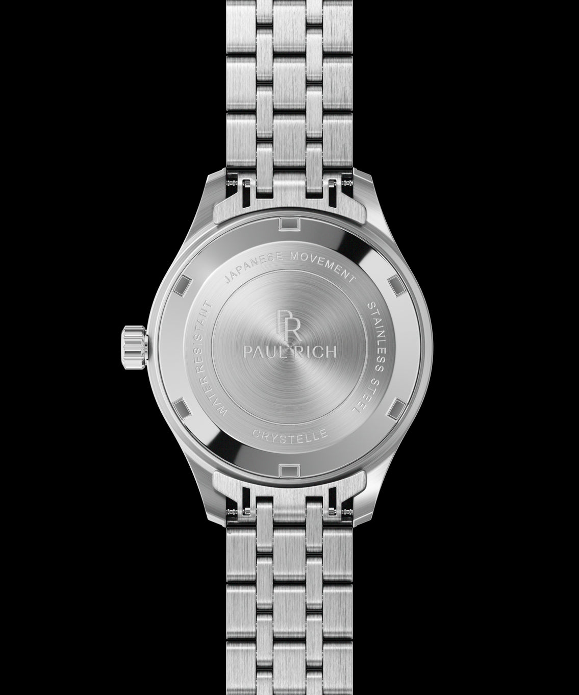 Back view of a silver-tone Paul Rich watch with engraved text: “Paul Rich,” “Japanese Movement,” “Stainless Steel,” “Water Resistant,” and “Crystelle.” Back view of a silver-tone Paul Rich watch with engraved text: “Paul Rich,” “Japanese Movement,” “Stainless Steel,” “Water Resistant,” and “Crystelle.”