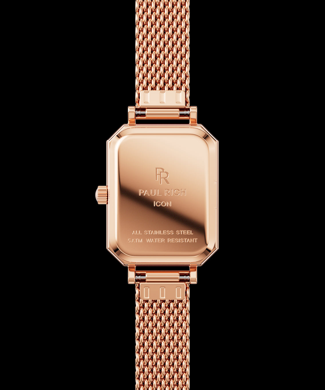 Back view of a rose gold Paul Rich watch with rectangular case, engraved with βPaul Rich ICON,β βAll Stainless Steel,β and β5ATM Water Resistant,β shown with a rose gold mesh strap. Back view of a rose gold Paul Rich watch with rectangular case, engraved with βPaul Rich ICON,β βAll Stainless Steel,β and β5ATM Water Resistant,β shown with a rose gold mesh strap.