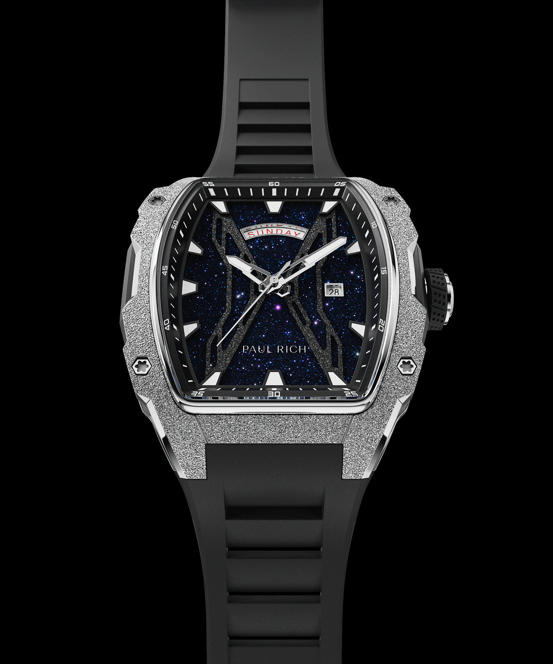 Paul Rich watch shown at an angle with blue aventurine dial, silver frosted bezel, day-date display, and full black rubber strap. Paul Rich watch shown at an angle with blue aventurine dial, silver frosted bezel, day-date display, and full black rubber strap.
