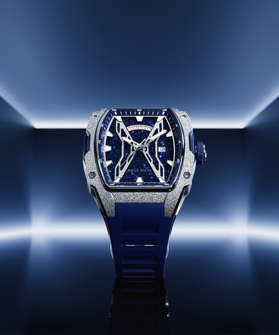 Paul Rich watch with blue aventurine dial, silver frosted bezel, and blue strap, displayed in neon blue-lit environment. Paul Rich watch with blue aventurine dial, silver frosted bezel, and blue strap, displayed in neon blue-lit environment.