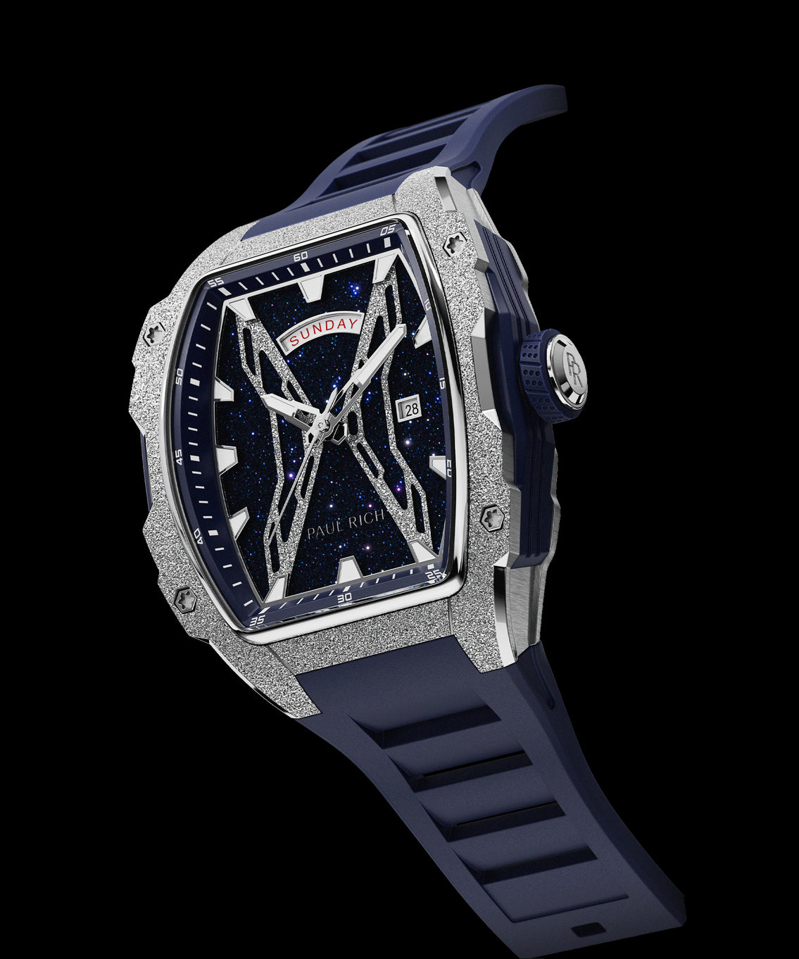 Angled view of Paul Rich watch with blue aventurine dial, silver frosted bezel, PR monogram crown, and matching blue rubber strap. Angled view of Paul Rich watch with blue aventurine dial, silver frosted bezel, PR monogram crown, and matching blue rubber strap.