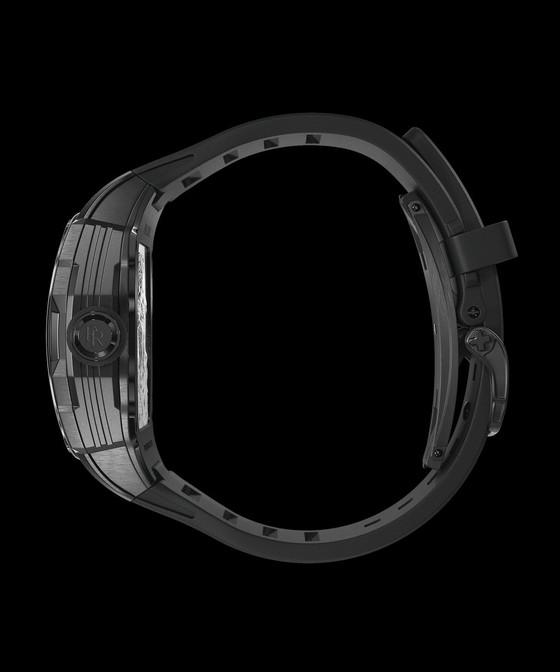 Side view of a black Paul Rich watch with a tonneau case, engraved crown featuring the “PR” logo, and a partially open black rubber strap with a deployment clasp. Side view of a black Paul Rich watch with a tonneau case, engraved crown featuring the “PR” logo, and a partially open black rubber strap with a deployment clasp.