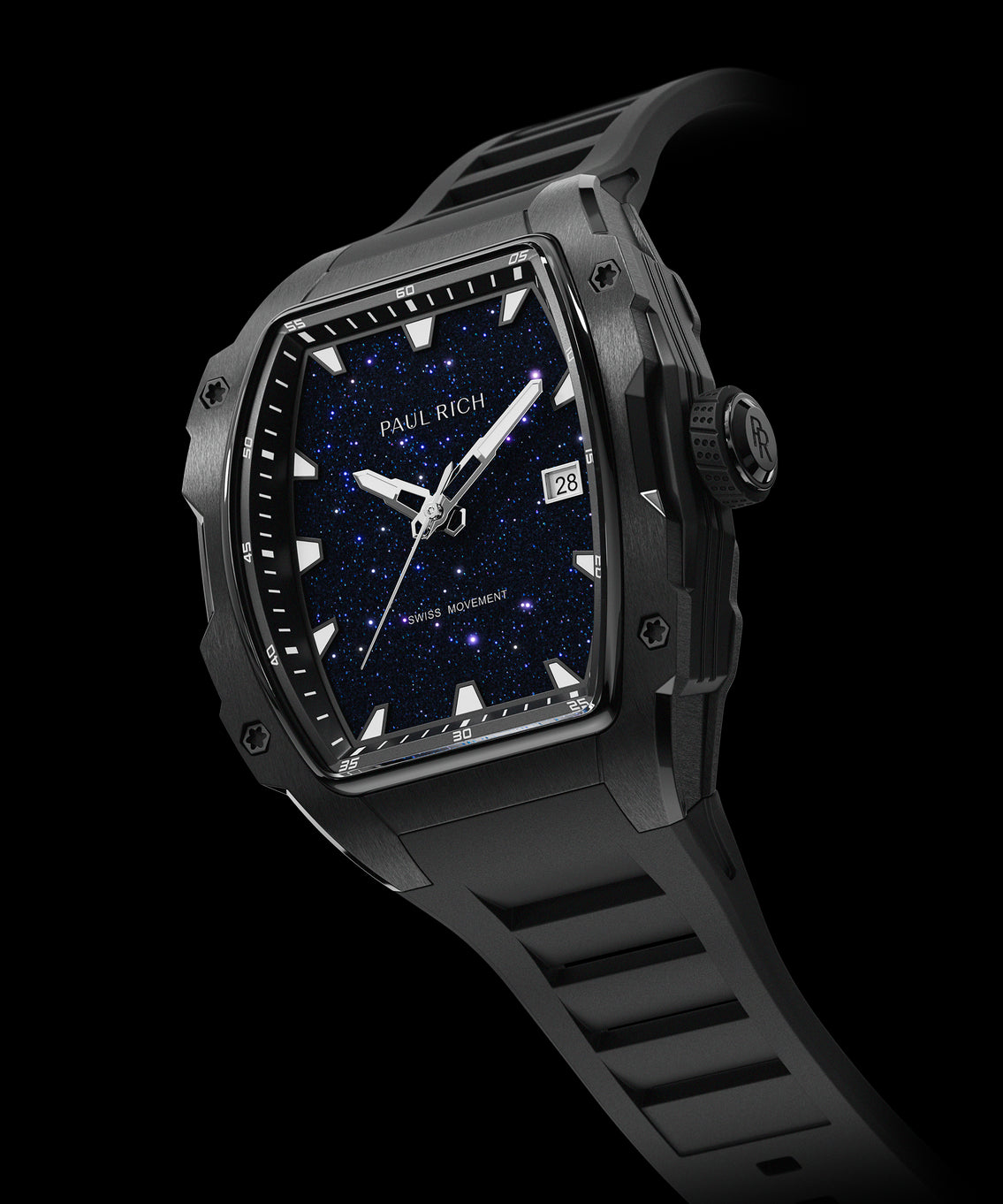 Angled view of a black Paul Rich watch with tonneau-shaped case, blue aventurine dial, white hands and markers, date display at 3 o'clock, and black rubber strap, labeled “Swiss Movement.” Angled view of a black Paul Rich watch with tonneau-shaped case, blue aventurine dial, white hands and markers, date display at 3 o'clock, and black rubber strap, labeled “Swiss Movement.”