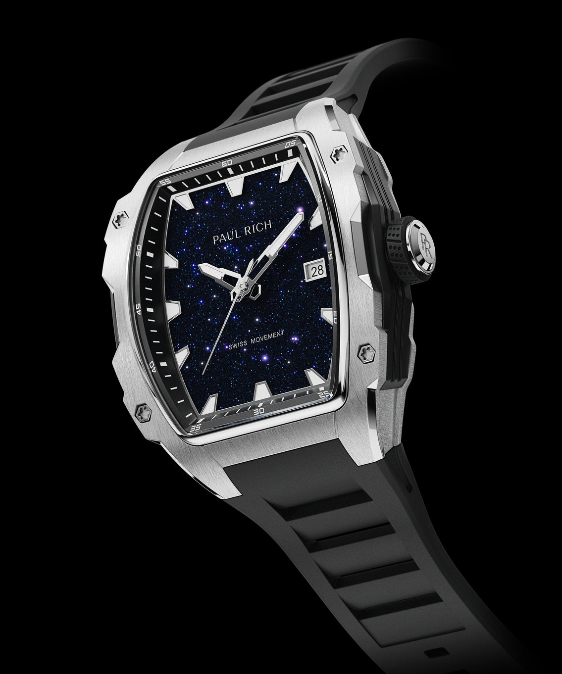 Angled view of a Paul Rich silver-tonneau watch with blue aventurine dial, silver hands, date window, and black textured rubber strap. Angled view of a Paul Rich silver-tonneau watch with blue aventurine dial, silver hands, date window, and black textured rubber strap.