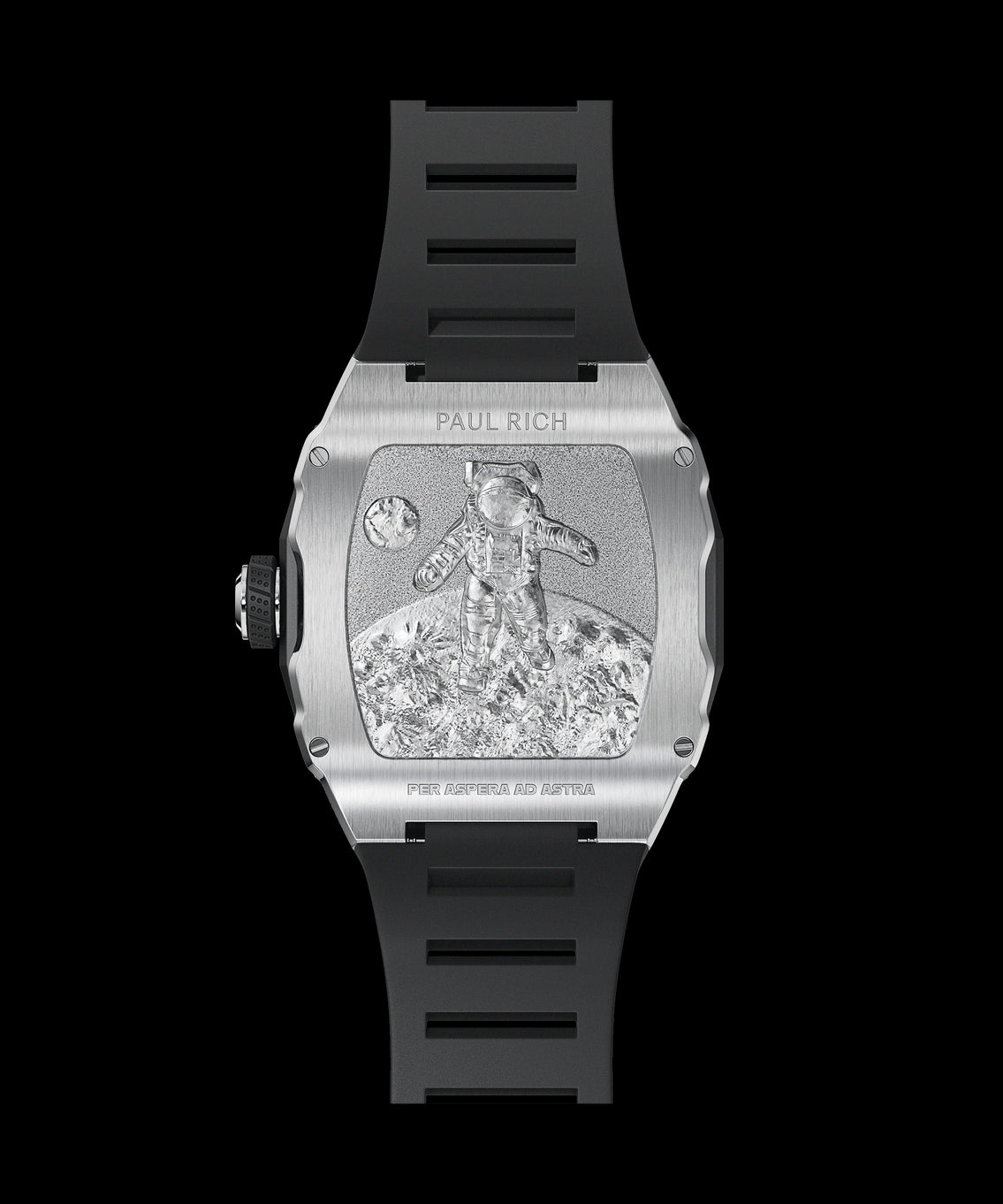 Back view of a Paul Rich silver-tonneau watch with engraved astronaut on the moon, “PER ASPERA AD ASTRA” inscription, and black rubber strap. Back view of a Paul Rich silver-tonneau watch with engraved astronaut on the moon, “PER ASPERA AD ASTRA” inscription, and black rubber strap.