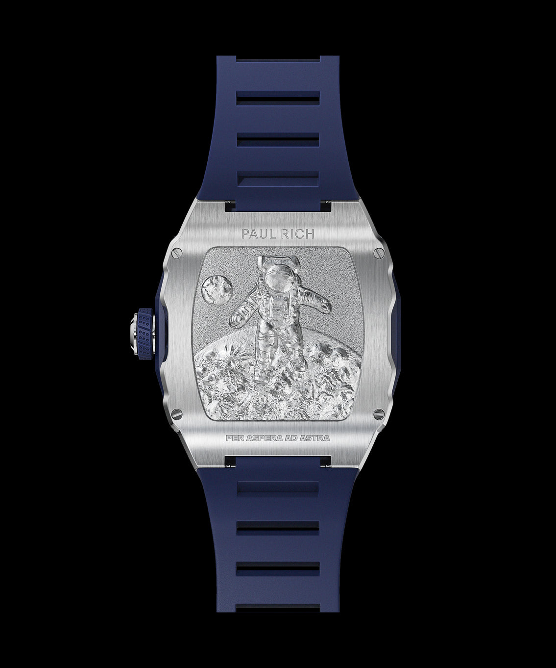 Back view of a Paul Rich silver-tonneau watch with engraved astronaut on the moon, “PER ASPERA AD ASTRA” inscription, and blue rubber strap. Back view of a Paul Rich silver-tonneau watch with engraved astronaut on the moon, “PER ASPERA AD ASTRA” inscription, and blue rubber strap.