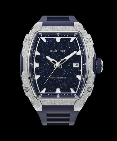 Astro Lunar Silver Paul Rich watch with frosted silver bezel, blue aventurine dial, date window, and blue rubber strap, in a tonneau-shaped case.