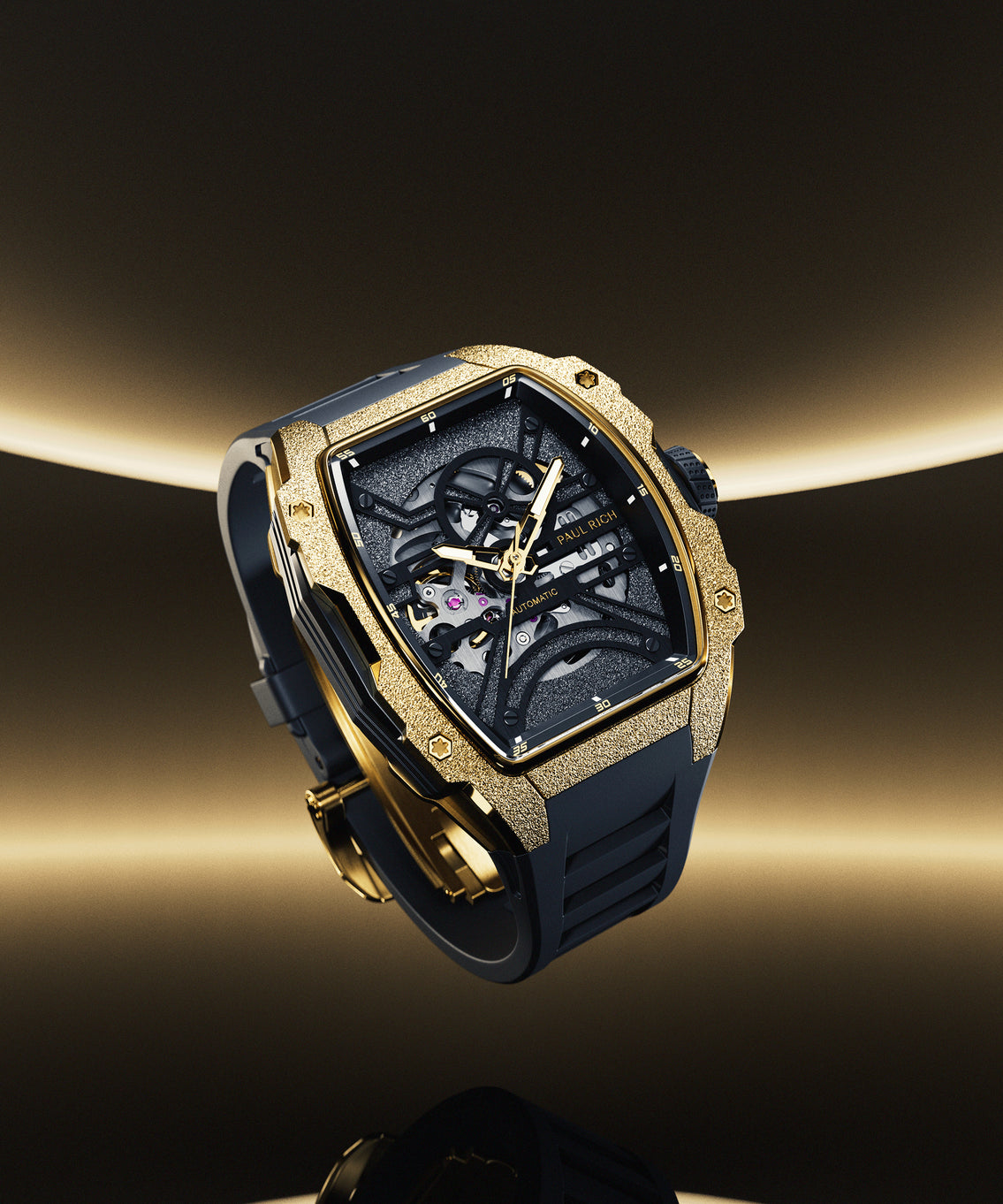 Paul Rich watch with frosted gold tonneau case, skeleton dial, and black strap, shown floating against a dark gold gradient background. Paul Rich watch with frosted gold tonneau case, skeleton dial, and black strap, shown floating against a dark gold gradient background.