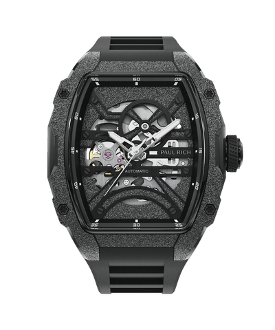 Astro Skeleton Galaxy Black Paul Rich watch with frosted black tonneau case, silver skeleton dial, white hands, and black rubber strap, shown on transparent background.