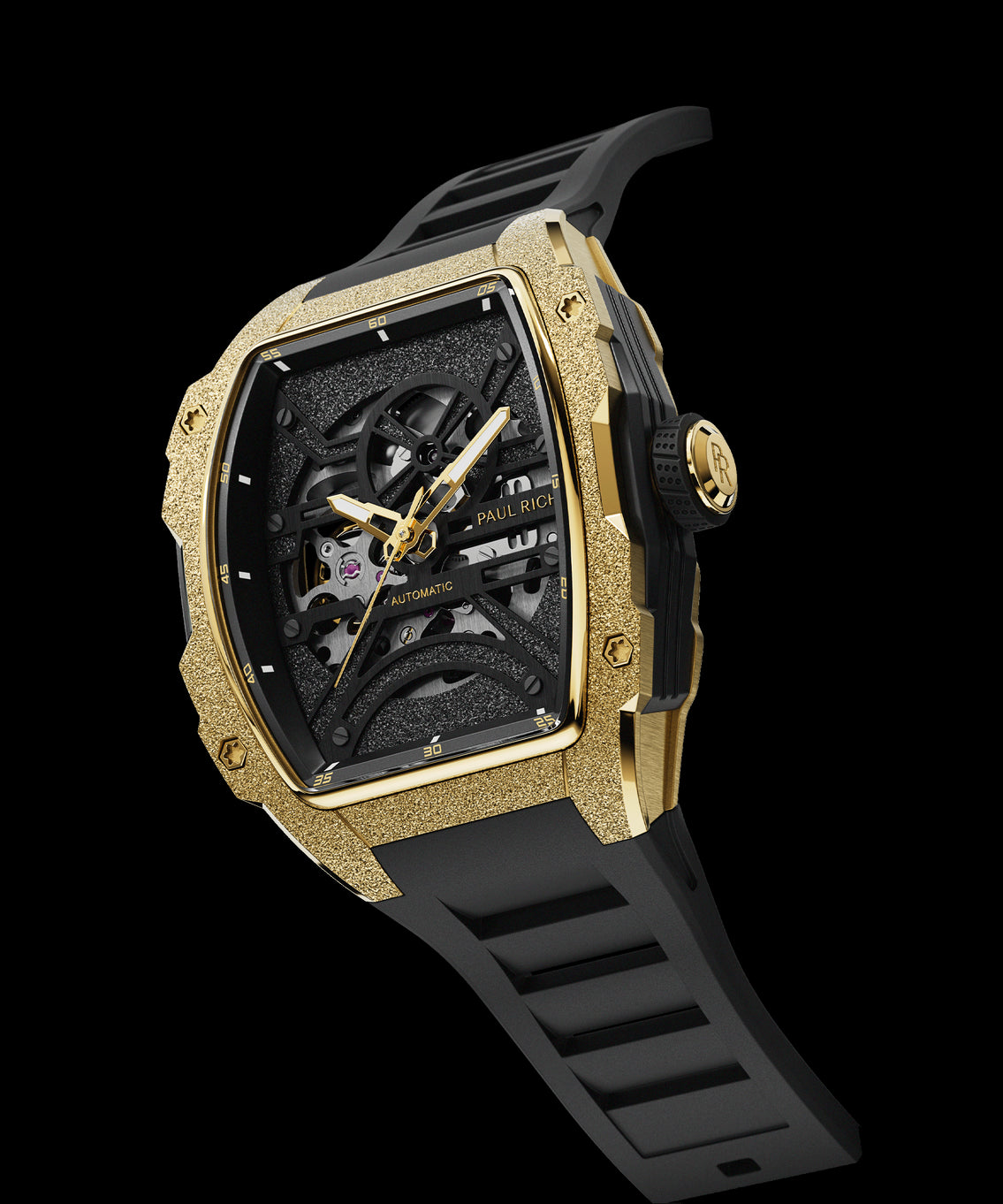 Angled view of Paul Rich watch with frosted gold tonneau case, skeleton dial, and black rubber strap, shown on transparent background. Angled view of Paul Rich watch with frosted gold tonneau case, skeleton dial, and black rubber strap, shown on transparent background.