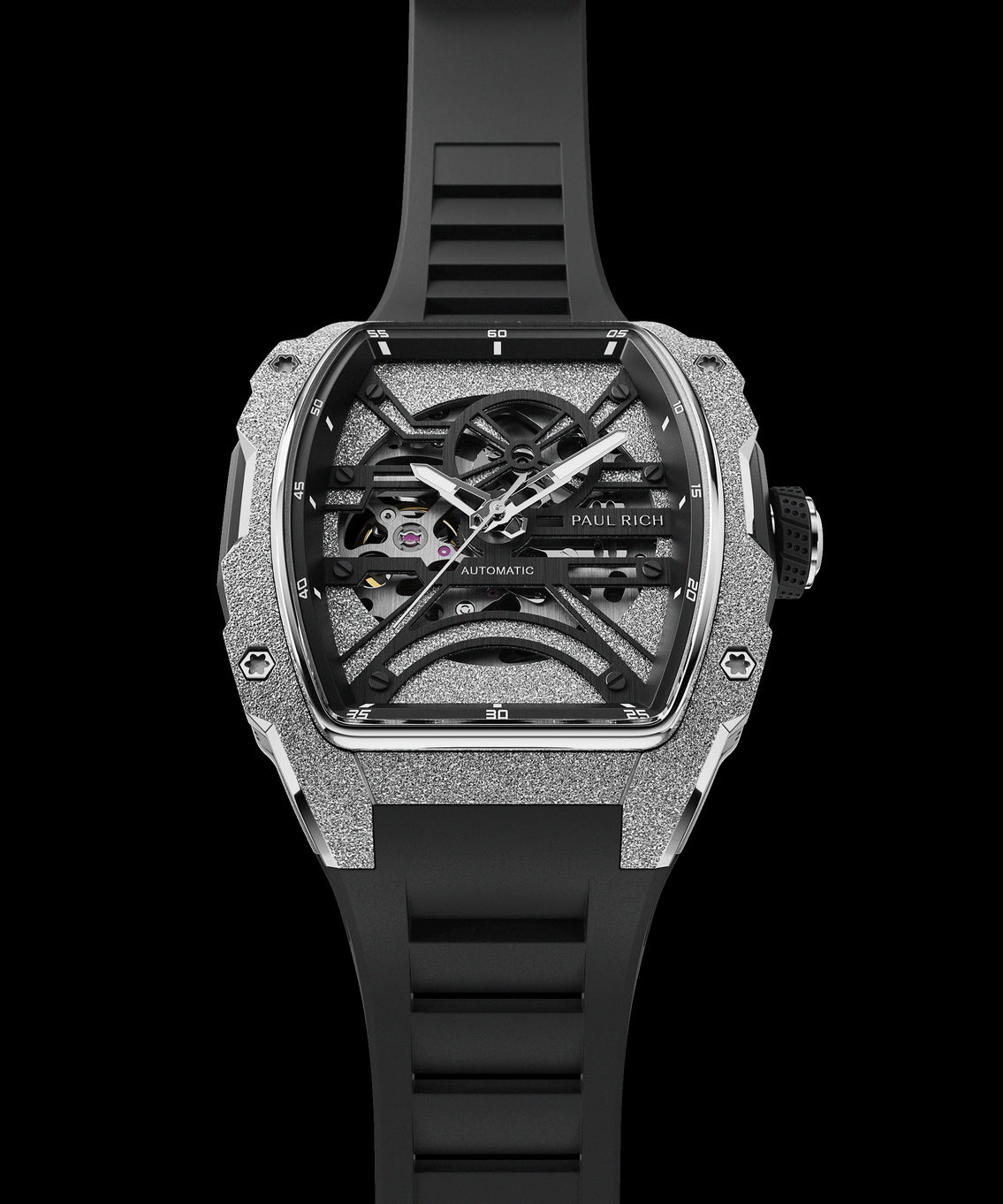 Front view of Paul Rich watch with frosted silver tonneau case, skeleton dial, white hands, and black rubber strap, shown vertically. Front view of Paul Rich watch with frosted silver tonneau case, skeleton dial, white hands, and black rubber strap, shown vertically.