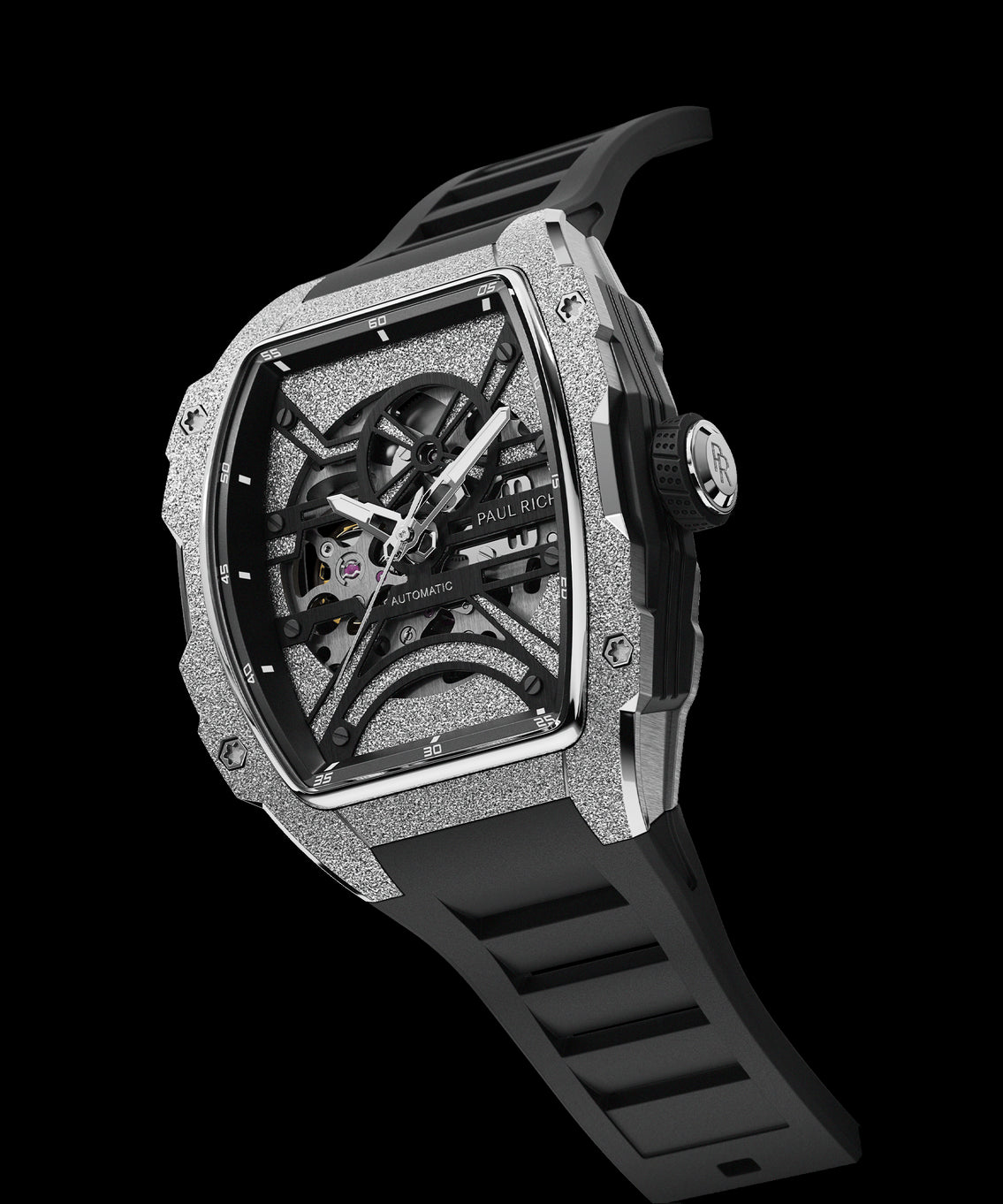 Angled view of Paul Rich watch with frosted silver tonneau case, skeleton dial, white hands, and black rubber strap, shown on transparent background. Angled view of Paul Rich watch with frosted silver tonneau case, skeleton dial, white hands, and black rubber strap, shown on transparent background.