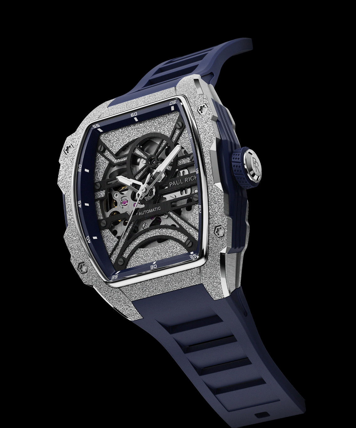 Angled view of Paul Rich watch with frosted silver tonneau case, skeleton dial, white hands, and blue rubber strap, shown on transparent background. Angled view of Paul Rich watch with frosted silver tonneau case, skeleton dial, white hands, and blue rubber strap, shown on transparent background.