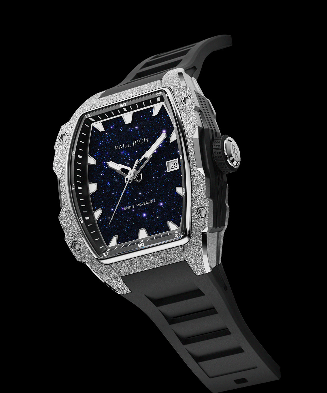 Angled view of Paul Rich watch with tonneau case, frosted silver bezel, blue aventurine dial, date window, PR monogram crown, and black rubber strap. Angled view of Paul Rich watch with tonneau case, frosted silver bezel, blue aventurine dial, date window, PR monogram crown, and black rubber strap.