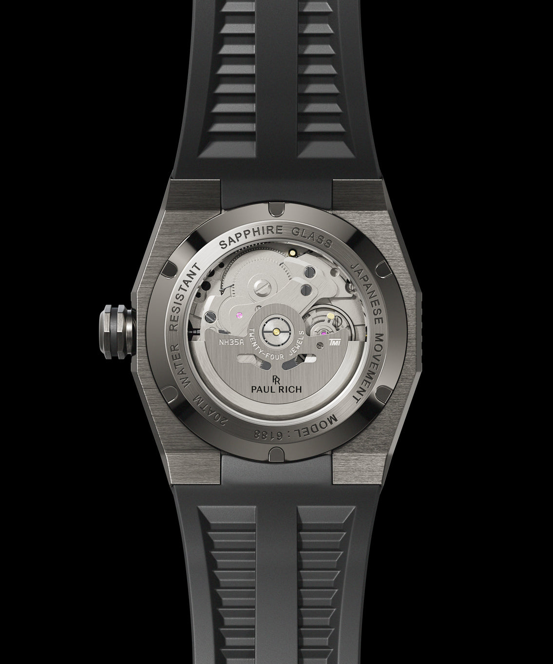 Back view of a Paul Rich dive watch with silver case, sapphire caseback showing NH35A automatic movement, and black rubber strap. Back view of a Paul Rich dive watch with silver case, sapphire caseback showing NH35A automatic movement, and black rubber strap.