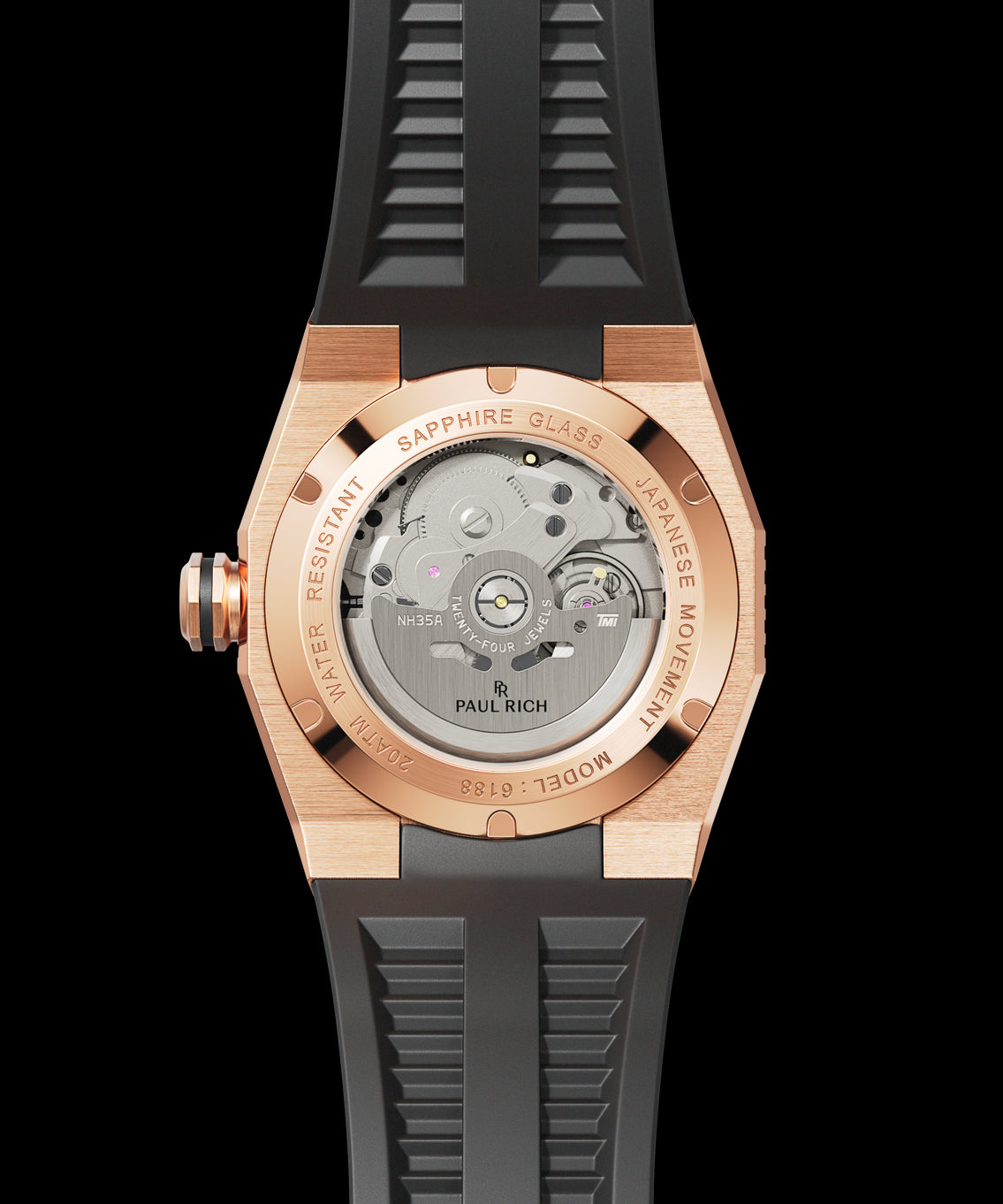 Back view of a Paul Rich watch with rose gold-toned case, see-through caseback showing automatic movement, and black rubber strap. Back view of a Paul Rich watch with rose gold-toned case, see-through caseback showing automatic movement, and black rubber strap.
