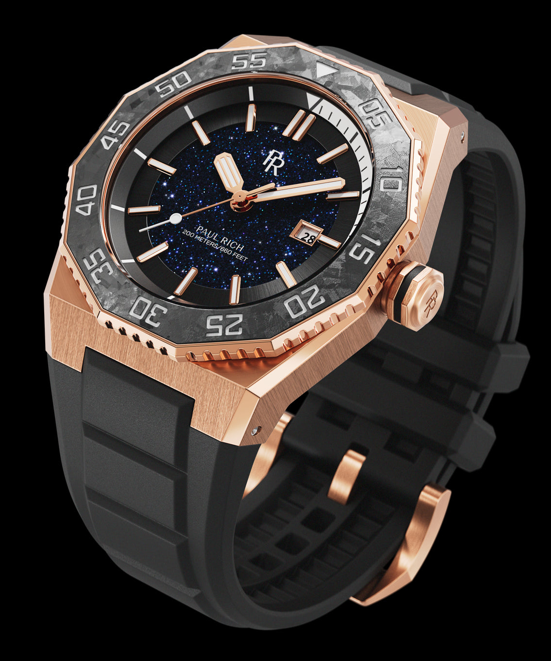 Angled view of a Paul Rich watch with rose gold case, blue aventurine dial, carbon bezel with white dive scale, and black rubber strap. Angled view of a Paul Rich watch with rose gold case, blue aventurine dial, carbon bezel with white dive scale, and black rubber strap.