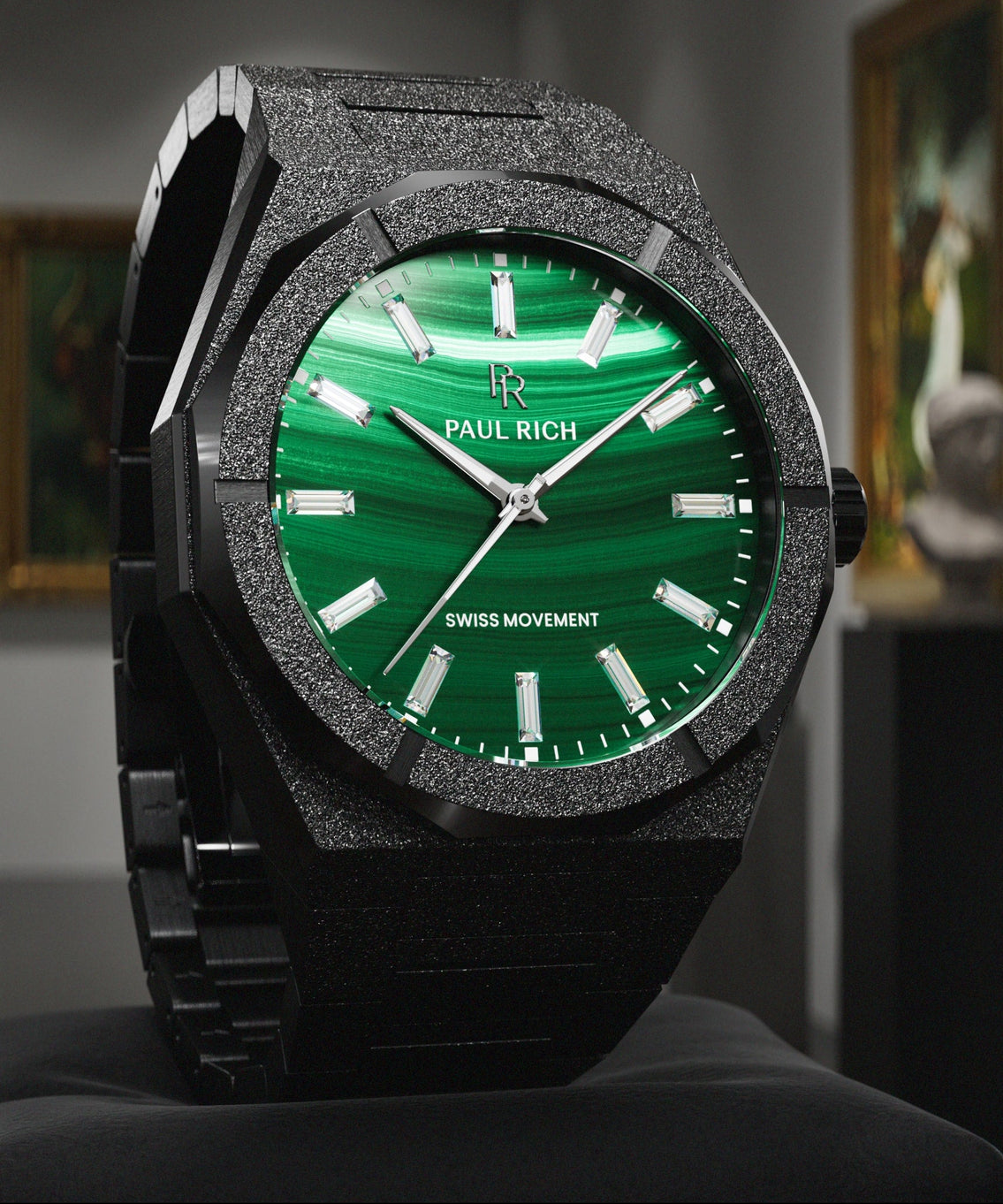 Black Malachite Aurora watch on a black cushion in a gallery with statues Black Malachite Aurora watch on a black cushion in a gallery with statues