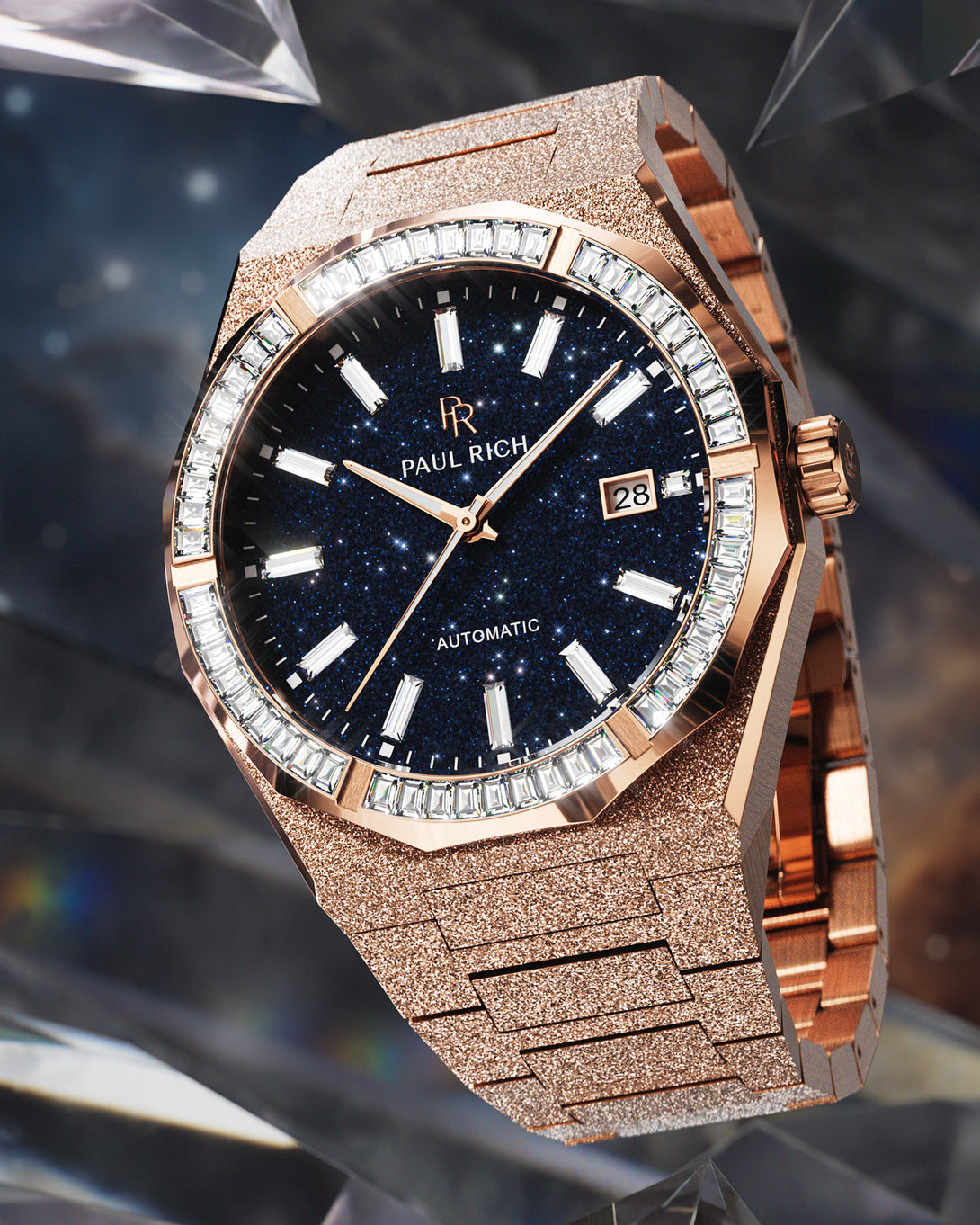 Rose gold automatic watch with a frosted case and bracelet, deep blue aventurine dial, and baguette-cut moissanite bezel displayed against a dark crystal-inspired cosmic background. Rose gold automatic watch with a frosted case and bracelet, deep blue aventurine dial, and baguette-cut moissanite bezel displayed against a dark crystal-inspired cosmic background.