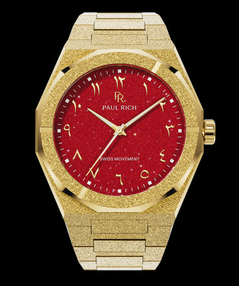 Frosted Star Dust II Desert Flame Paul Rich watch with frosted gold case and bracelet, featuring a red aventurine dial with Arabic numerals and gold hands.