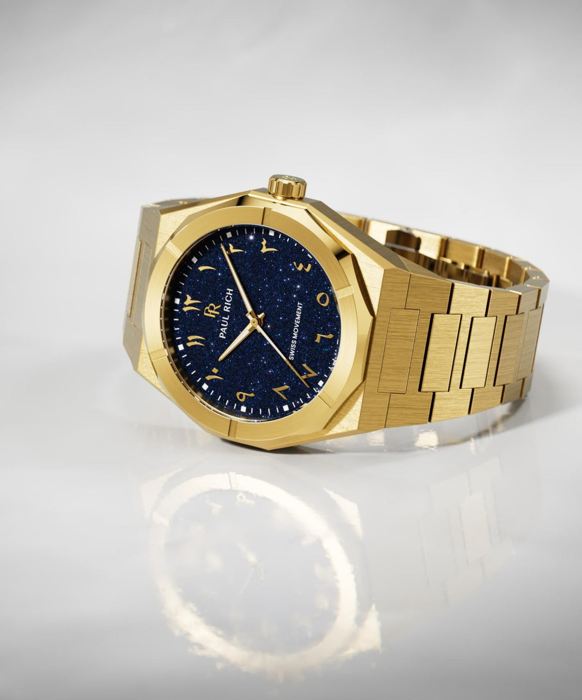 Paul Rich watch with brushed gold case and bracelet, blue aventurine dial with Arabic numerals, displayed on a glossy white surface. Paul Rich watch with brushed gold case and bracelet, blue aventurine dial with Arabic numerals, displayed on a glossy white surface.