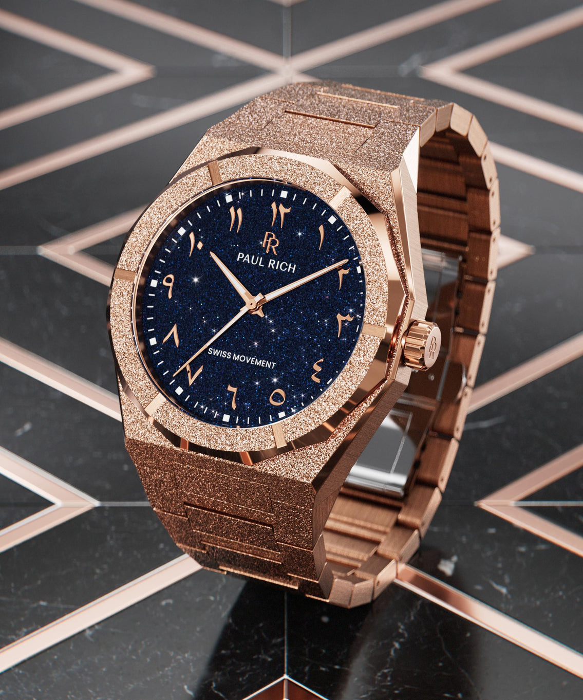 Frosted rose gold watch with blue aventurine dial and Arabic numerals, displayed on a glossy black and rose gold geometric surface. Frosted rose gold watch with blue aventurine dial and Arabic numerals, displayed on a glossy black and rose gold geometric surface.