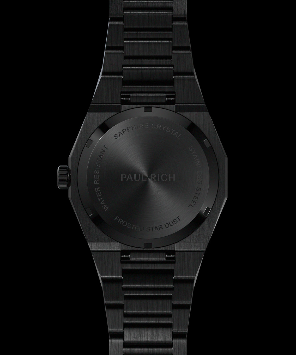 Back view of a black watch showing engraved case back with βPaul Rich,β βFrosted Star Dust,β and βSapphire Crystal Stainless Steel.β Back view of a black watch showing engraved case back with βPaul Rich,β βFrosted Star Dust,β and βSapphire Crystal Stainless Steel.β