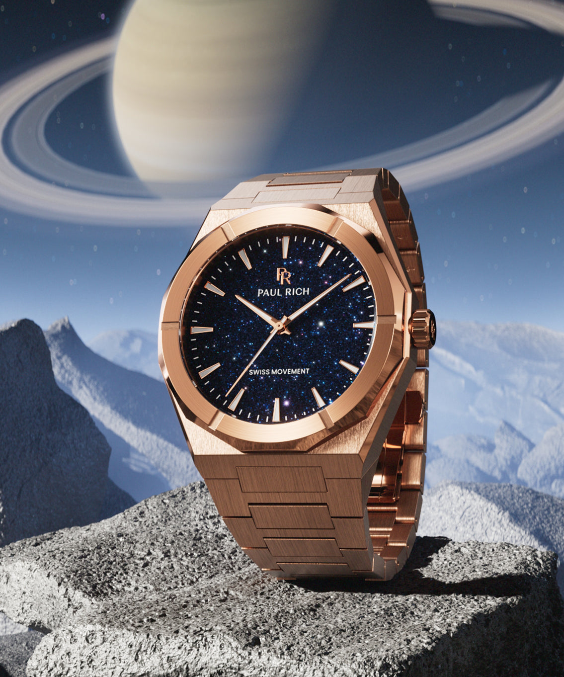 Rose gold Paul Rich watch with blue aventurine dial displayed on rocky terrain, with Saturn and its rings in the starry sky background. Rose gold Paul Rich watch with blue aventurine dial displayed on rocky terrain, with Saturn and its rings in the starry sky background.