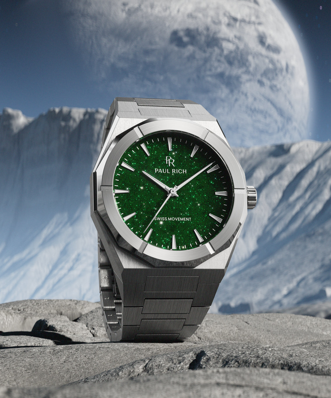 Silver Paul Rich watch with green aventurine dial placed on rocky terrain, with icy cliffs and a massive planet visible in the background. Silver Paul Rich watch with green aventurine dial placed on rocky terrain, with icy cliffs and a massive planet visible in the background.