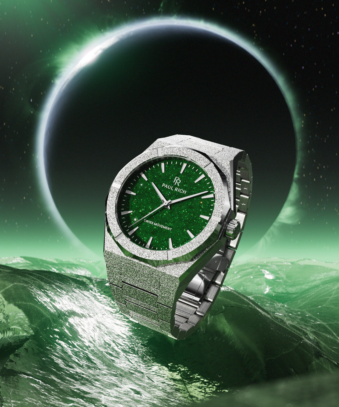 Silver Paul Rich watch with green aventurine dial floats above glowing green waves, backed by a black planet haloed in light. Silver Paul Rich watch with green aventurine dial floats above glowing green waves, backed by a black planet haloed in light.