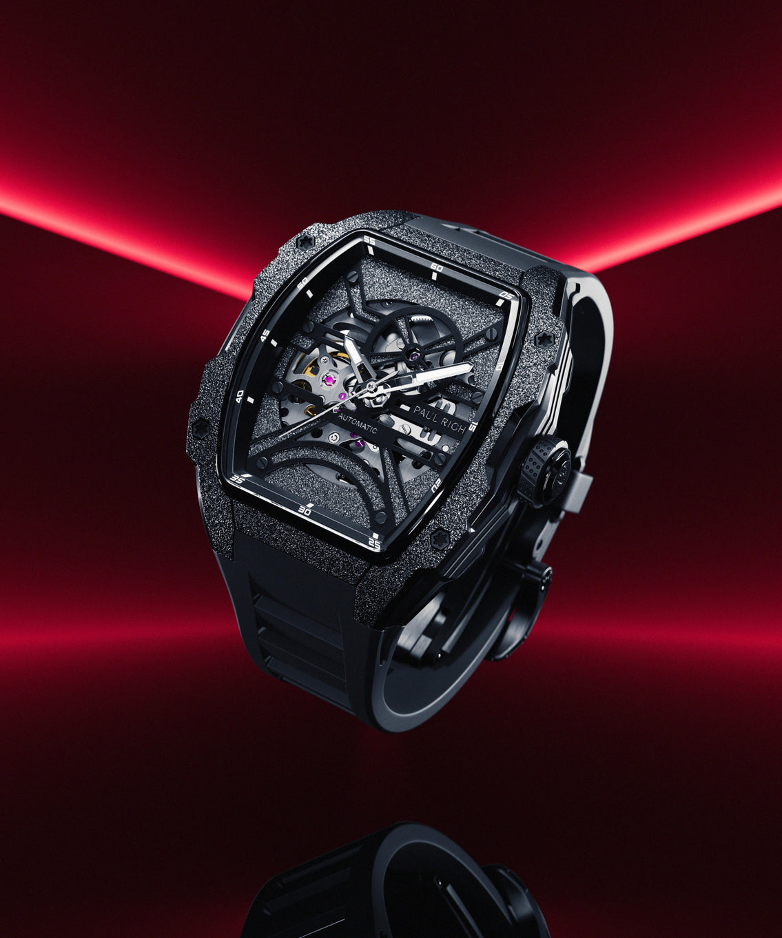 Paul Rich watch with frosted black tonneau case and skeleton dial, floating against a dark red gradient background with light red light beams. Paul Rich watch with frosted black tonneau case and skeleton dial, floating against a dark red gradient background with light red light beams.