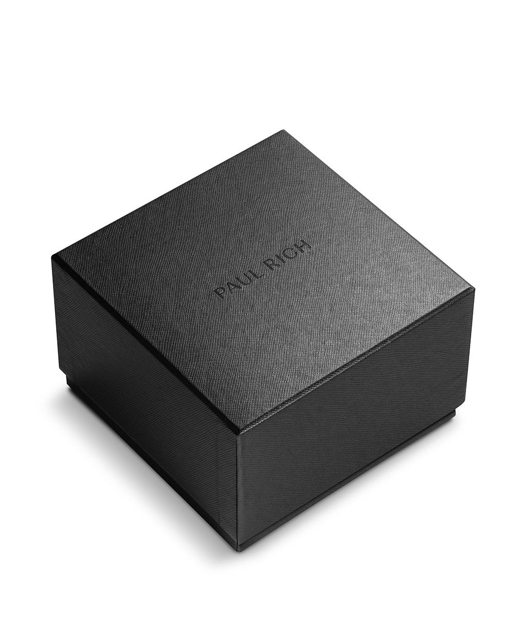 Closed black Paul Rich watch box with textured finish and embossed logo on lid, photographed on a white background. Closed black Paul Rich watch box with textured finish and embossed logo on lid, photographed on a white background.