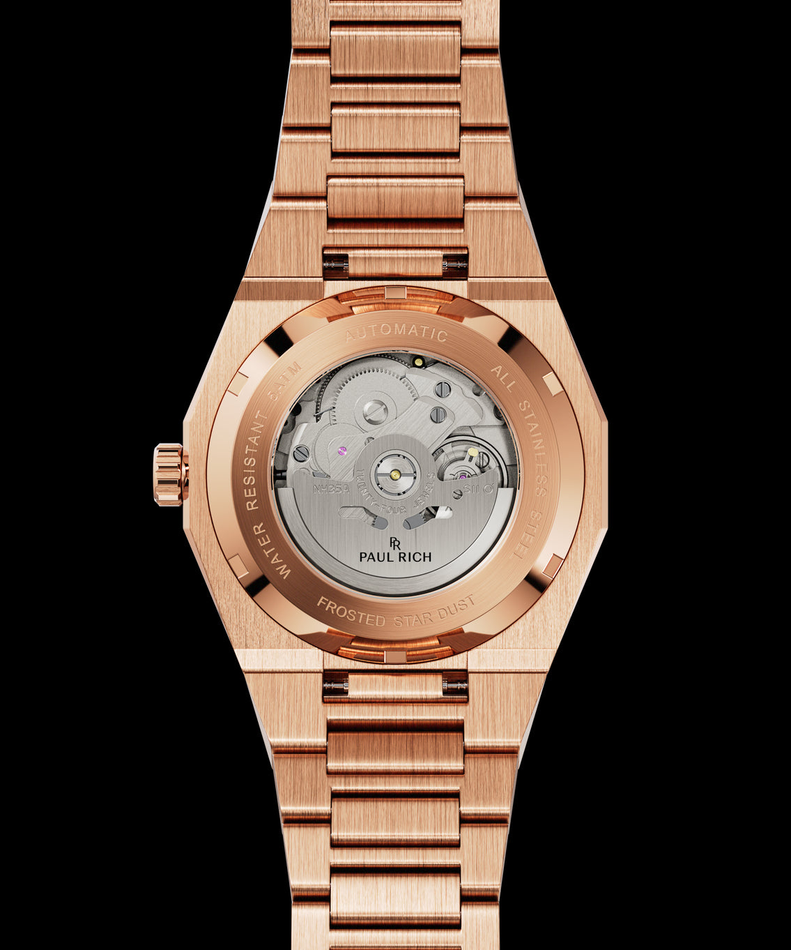 Back of rose gold Paul Rich watch with sapphire caseback showing automatic movement and “Frosted Star Dust” engraved on rim. Back of rose gold Paul Rich watch with sapphire caseback showing automatic movement and “Frosted Star Dust” engraved on rim.