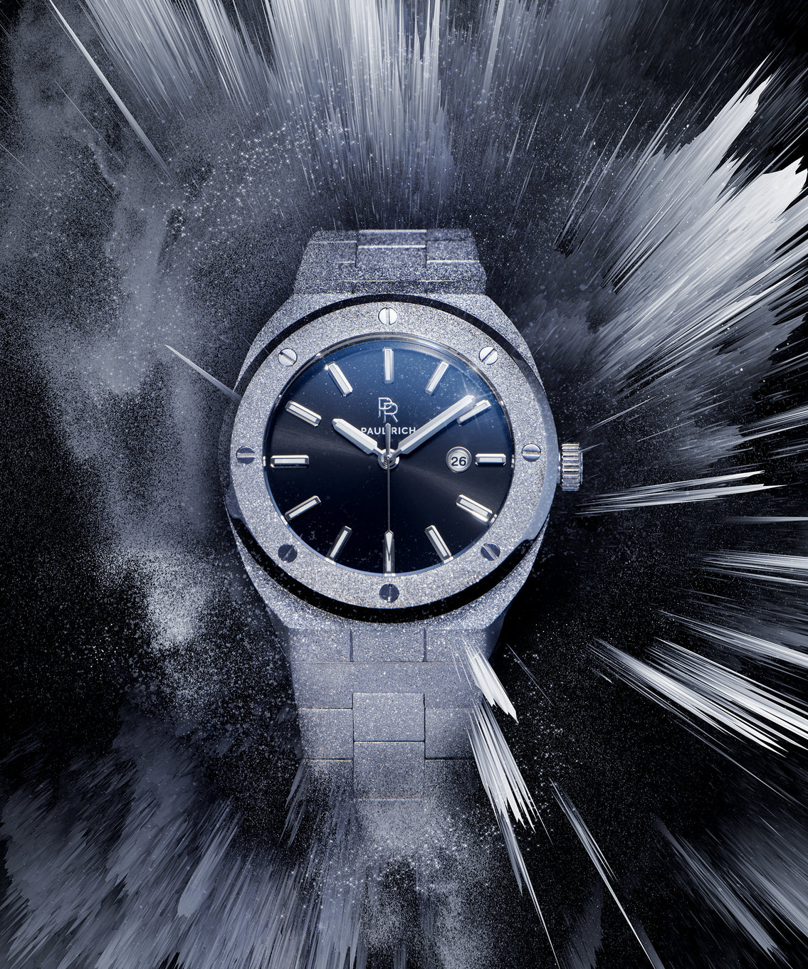 Paul Rich watch with frosted silver case and bracelet, metallic black sunray dial, and date window, displayed in a dynamic icy burst effect on dark background. Paul Rich watch with frosted silver case and bracelet, metallic black sunray dial, and date window, displayed in a dynamic icy burst effect on dark background.