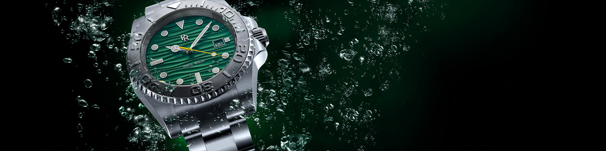 Stainless steel dive watch with green wave-textured dial, rotating bezel, and steel bracelet, shown underwater with rising bubbles.