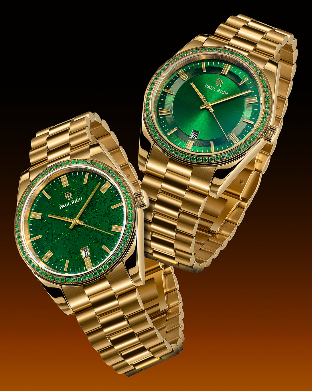 Two gold watches with green dials and green gemstone-set bezels on gold bracelets, one featuring an aventurine dial and the other a sunray dial, displayed against a dark orange gradient background.