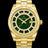 Gold watch with a green aventurine dial, day and date windows, and a bezel and hour markers set with clear stones on a full gold bracelet.