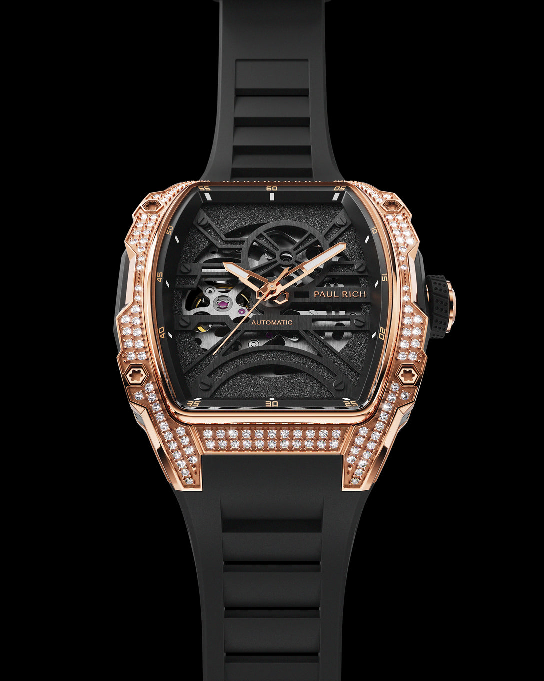 Luxury skeleton watch with rose gold and diamond case, black dial, and black strap shown on a white background.