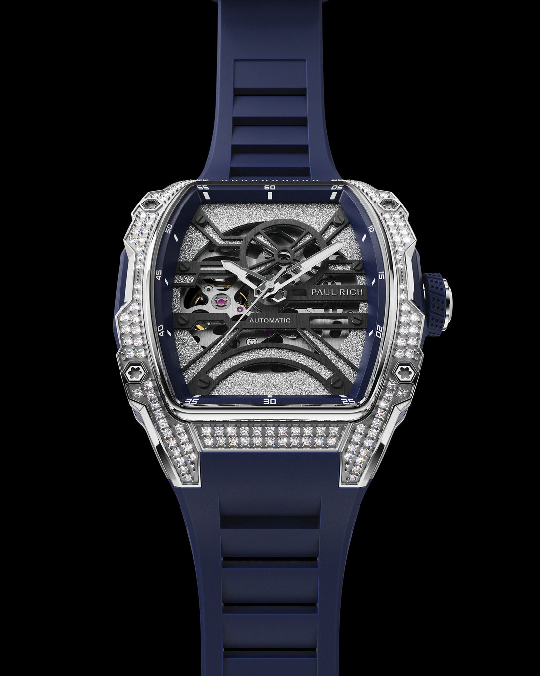 Front view of open dial watch with diamond-set silver case and navy blue strap, shown on transparent background.