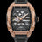 Front view of open dial watch with diamond-set rose gold case and black strap on white background.