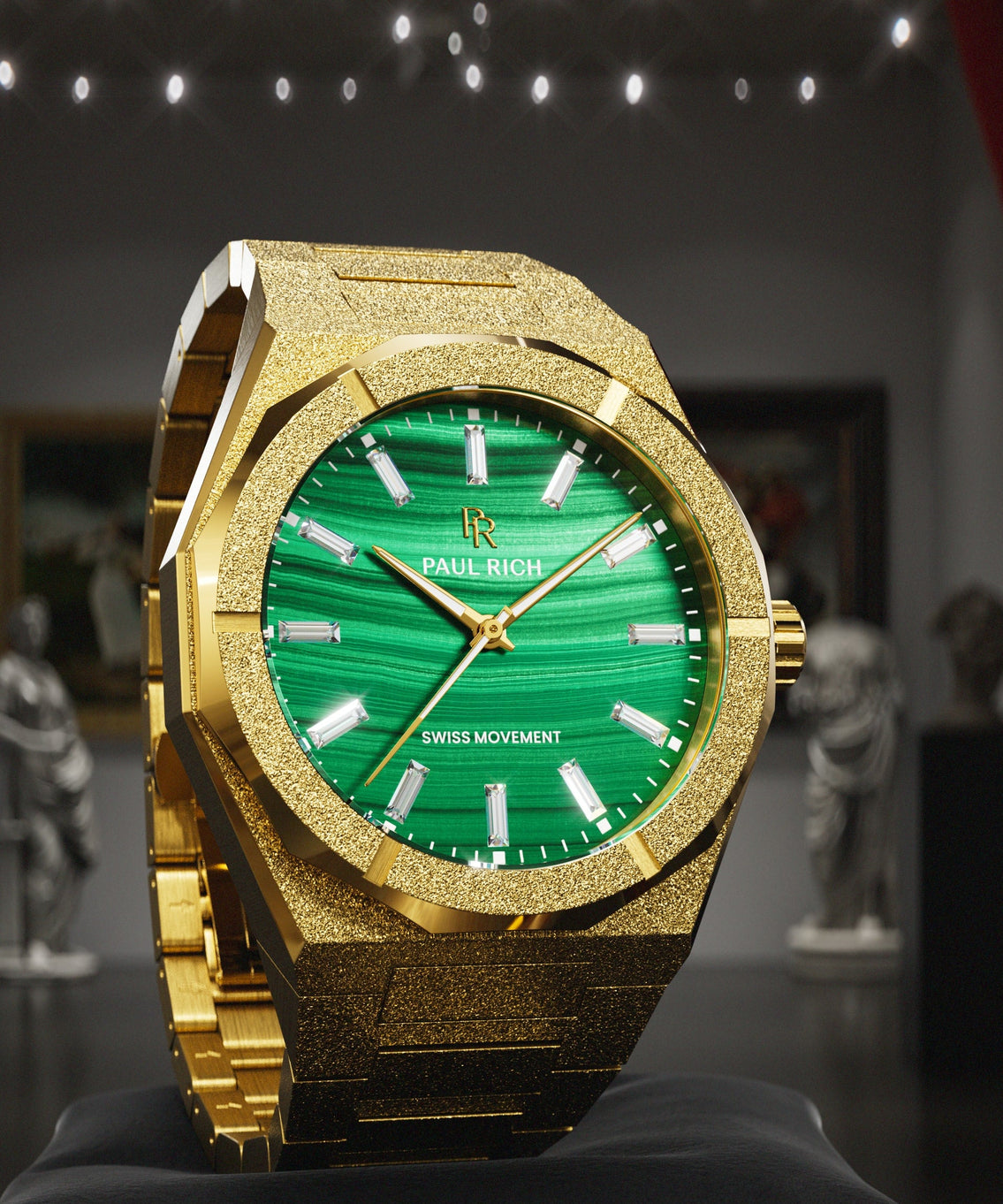 Gold-tone Malachite Aurora watch on a black cushion in a gallery with statues