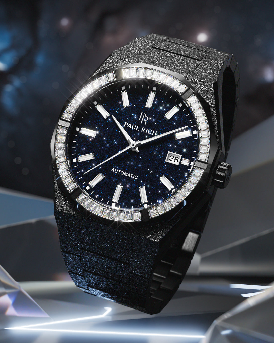 Black Paul Rich watch with frosted texture, blue aventurine dial, and gem-set bezel, displayed against a cosmic-inspired background.